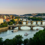View to Prague bridges on Vltava from view point Letensky profil at sunset