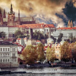 View of old town and Prague castle with river Vltava at sunset