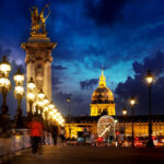 Pont Alexandre III and Les Invalides in Paris in the evening, France